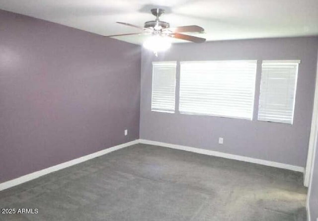 unfurnished room with ceiling fan, carpet flooring, and baseboards