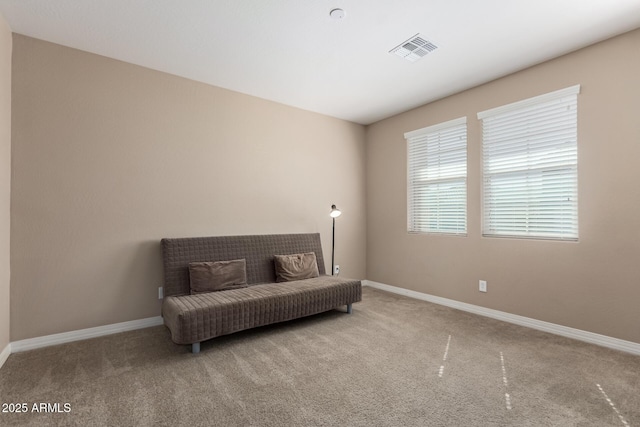 sitting room with carpet, visible vents, and baseboards