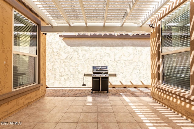 view of patio / terrace featuring a grill and a pergola