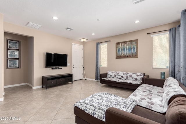 living room with light tile patterned floors, baseboards, visible vents, and recessed lighting