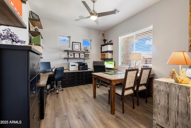 6135 E Livingston Loop, Prescott Valley, AZ 86314 - office area with light wood finished floors and a ceiling fan