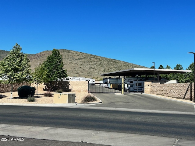 6135 E Livingston Loop, Prescott Valley, AZ 86314 - view of home's exterior featuring a gate, fence, and a mountain view