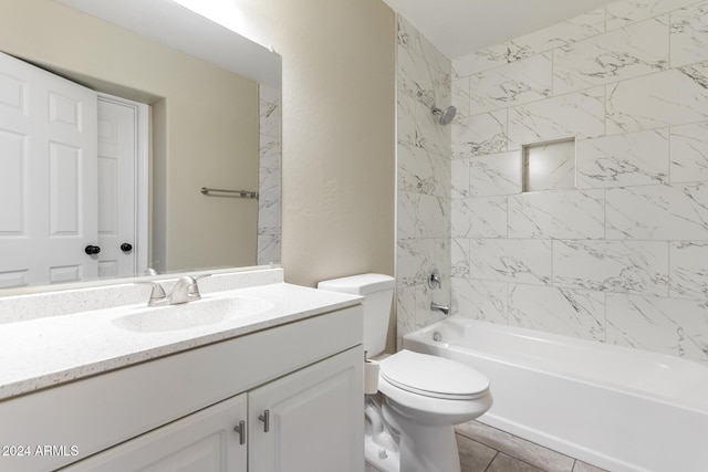 full bathroom featuring tile patterned flooring, vanity, toilet, and tiled shower / bath