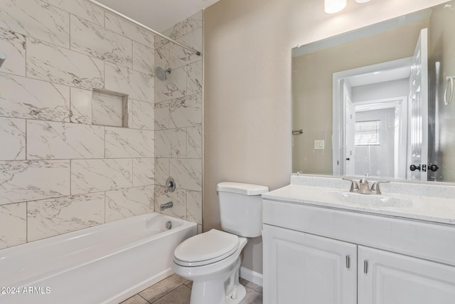 full bathroom with tile patterned floors, vanity, toilet, and tiled shower / bath