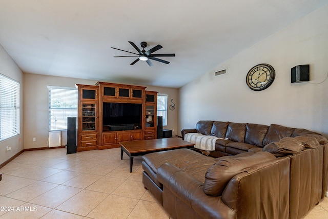 tiled living room featuring ceiling fan