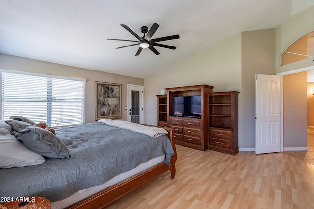 bedroom featuring light wood-type flooring, ceiling fan, and lofted ceiling