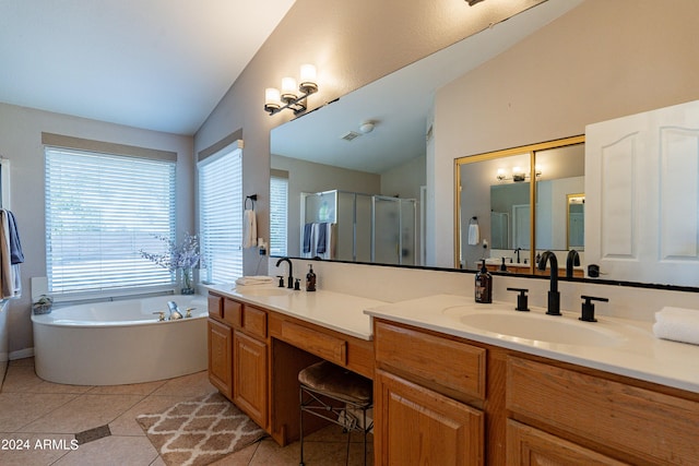 bathroom featuring tile patterned flooring, vanity, separate shower and tub, and vaulted ceiling