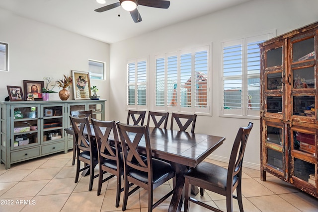 dining room with ceiling fan and light tile patterned flooring