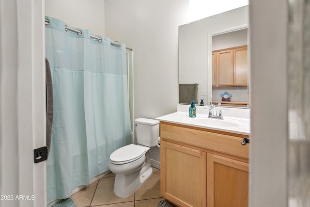 bathroom featuring walk in shower, tile patterned flooring, vanity, and toilet