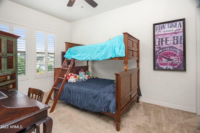 bedroom with ceiling fan and light colored carpet