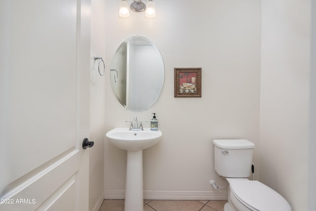 bathroom with tile patterned flooring and toilet