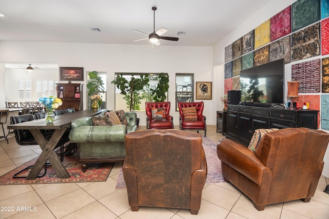 tiled living room featuring ceiling fan