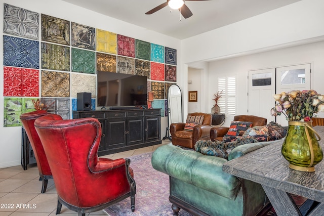 tiled living room with ceiling fan