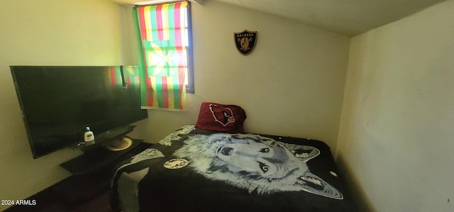 bedroom with vaulted ceiling