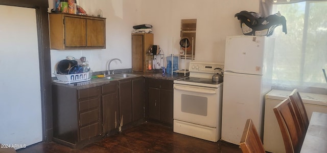 kitchen with sink, white appliances, and dark hardwood / wood-style flooring