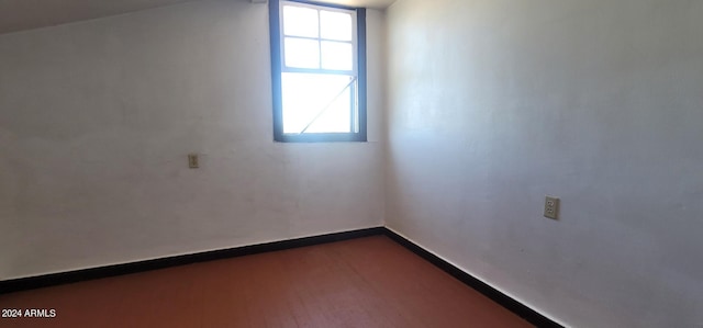 empty room featuring dark wood-type flooring