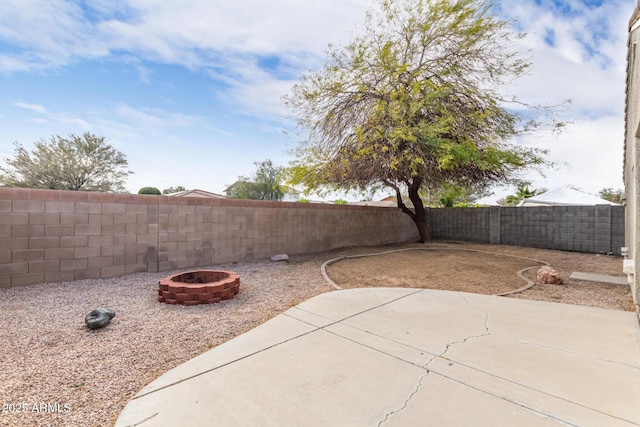 view of patio / terrace featuring a fenced backyard and an outdoor fire pit