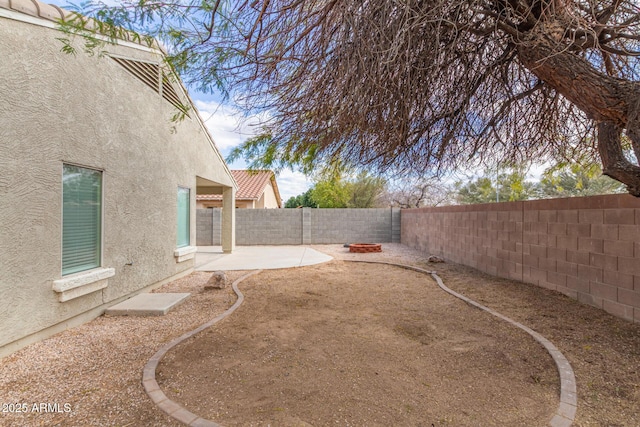 view of yard with a fenced backyard and a patio area