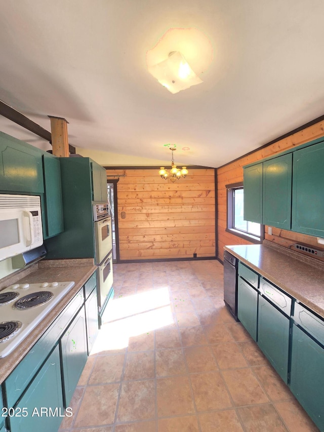 kitchen featuring white appliances, a notable chandelier, green cabinetry, and wood walls