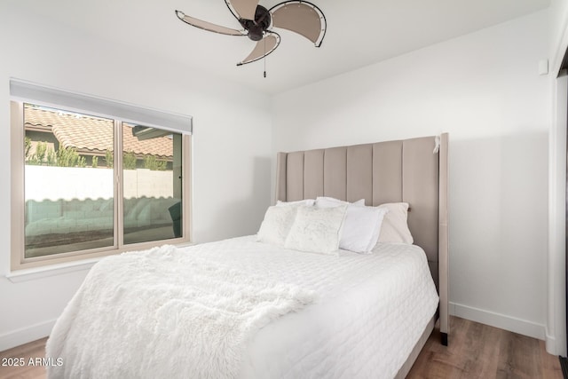 bedroom featuring wood-type flooring and ceiling fan