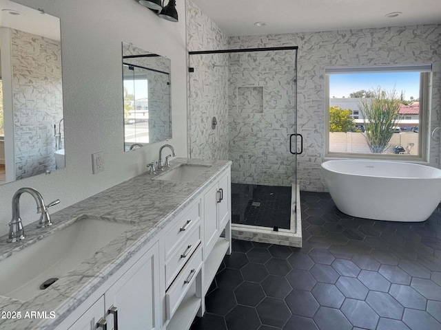 bathroom featuring vanity, independent shower and bath, and tile patterned flooring