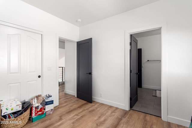 bedroom featuring a closet and light hardwood / wood-style flooring