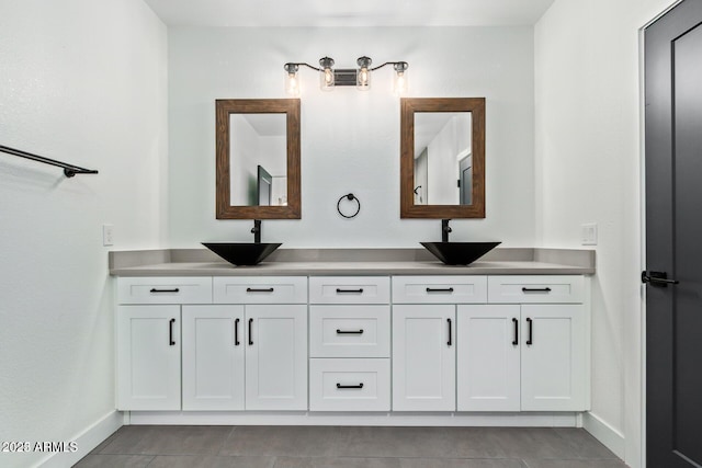 bathroom with tile patterned flooring and vanity