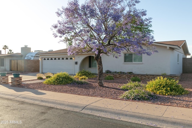 1894 E Julie Dr, Tempe, AZ 85283 - view of front of property featuring a garage, stucco siding, and driveway