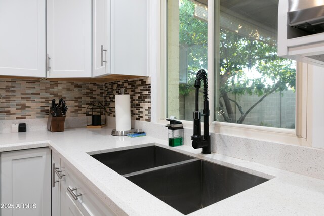 1894 E Julie Dr, Tempe, AZ 85283 - kitchen featuring a sink, white cabinets, tasteful backsplash, and light stone countertops