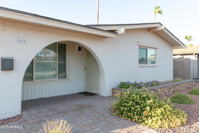 1894 E Julie Dr, Tempe, AZ 85283 - view of exterior entry with stucco siding and a patio