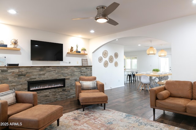 1894 E Julie Dr, Tempe, AZ 85283 - living area featuring a ceiling fan, arched walkways, wood finished floors, a fireplace, and recessed lighting