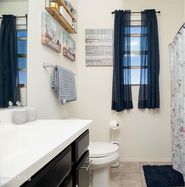 full bathroom with tile patterned floors, toilet, vanity, and baseboards