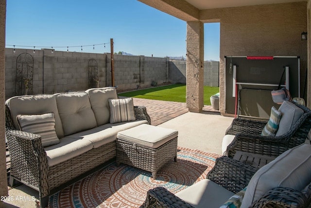 view of patio with outdoor lounge area and a fenced backyard