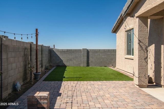 view of patio with a fenced backyard