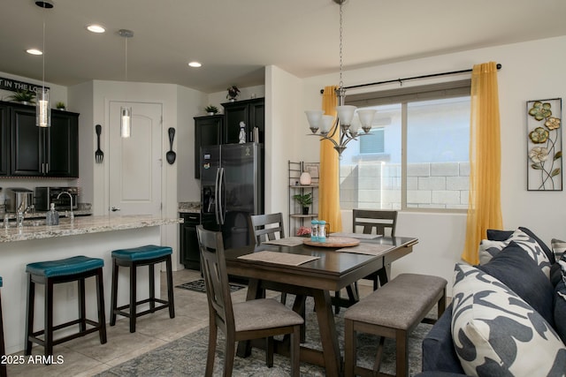 dining area featuring an inviting chandelier and recessed lighting