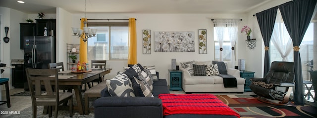 living area featuring a notable chandelier