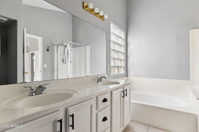 bathroom with tile patterned flooring, vanity, and plus walk in shower