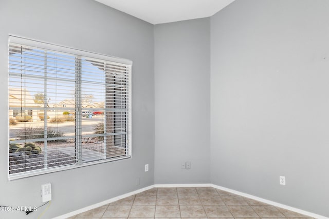 spare room with light tile patterned floors