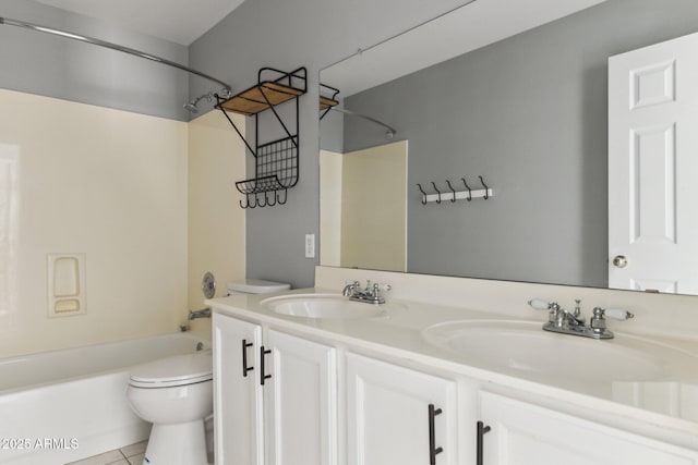 full bathroom featuring shower / bathing tub combination, vanity, tile patterned floors, and toilet