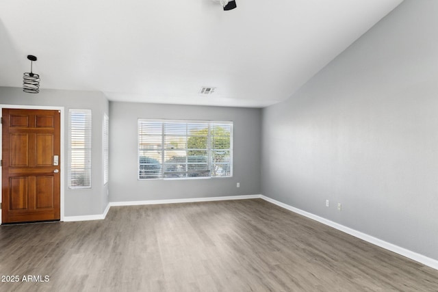 entryway with hardwood / wood-style floors