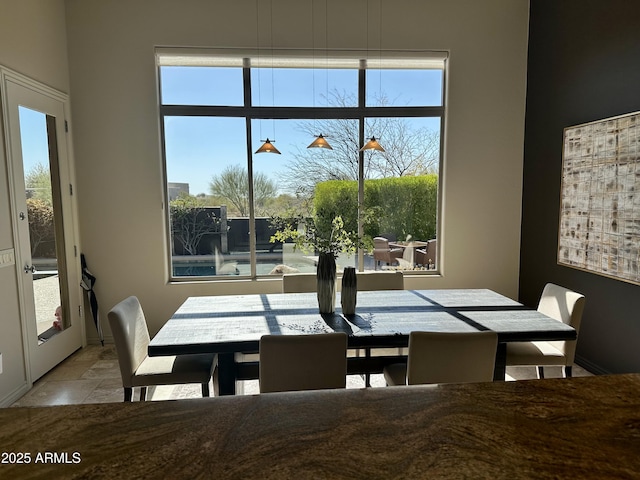 dining area with stone finish floor