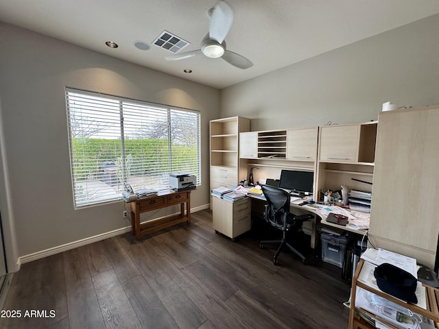 office space with visible vents, baseboards, dark wood-type flooring, and ceiling fan