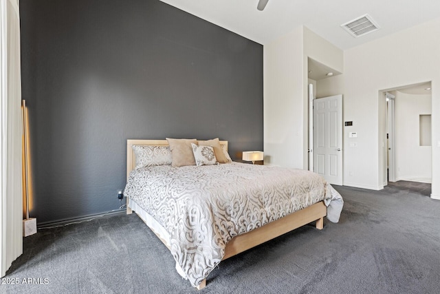 carpeted bedroom with visible vents, ceiling fan, and baseboards