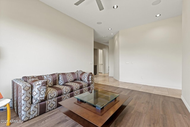 living room with wood finished floors, recessed lighting, a ceiling fan, and baseboards