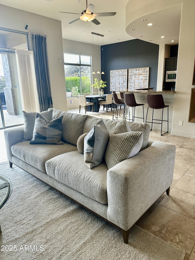 living room featuring recessed lighting and ceiling fan