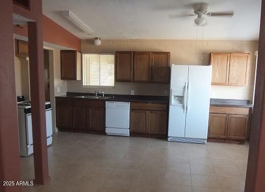 kitchen with ceiling fan, sink, and white appliances