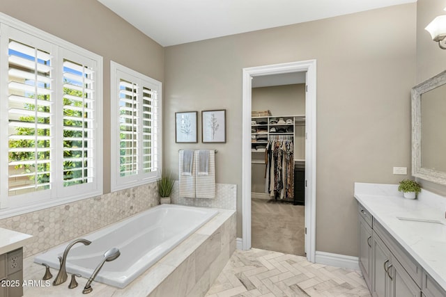 2051 E Aris Dr, Gilbert, AZ 85298 - full bathroom with a walk in closet, a garden tub, and vanity