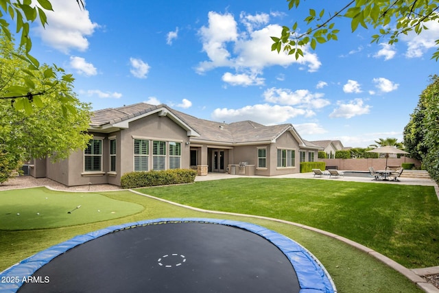 2051 E Aris Dr, Gilbert, AZ 85298 - back of property featuring stucco siding, fence, a patio area, and a lawn