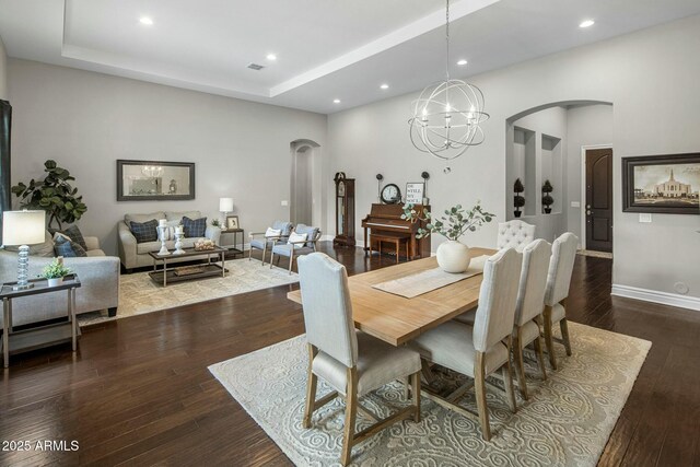 2051 E Aris Dr, Gilbert, AZ 85298 - dining space with arched walkways, wood finished floors, and recessed lighting