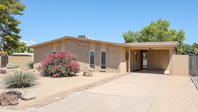 view of front of property featuring a carport